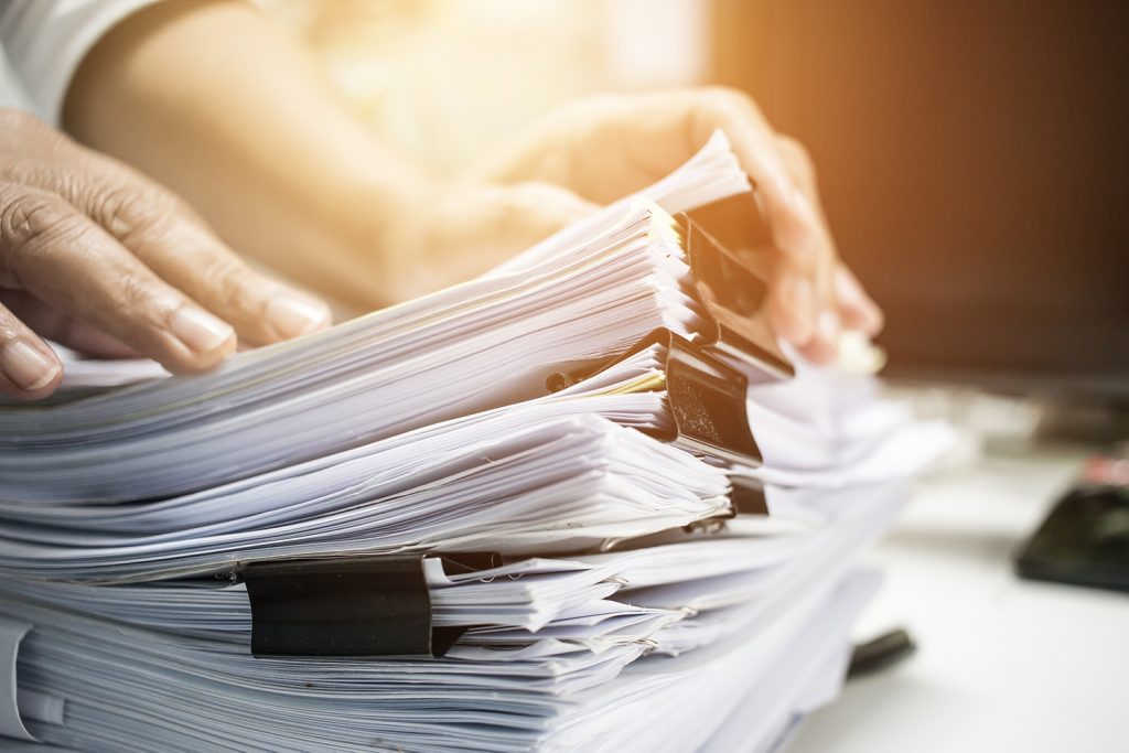 Person looking through paper files